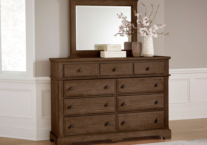 Generously scaled Nine Drawer Bureau featuring hammered pilasters, and intricately designed base rails. A relaxed traditional style constructed of Solid Oak American-grown hardwood.