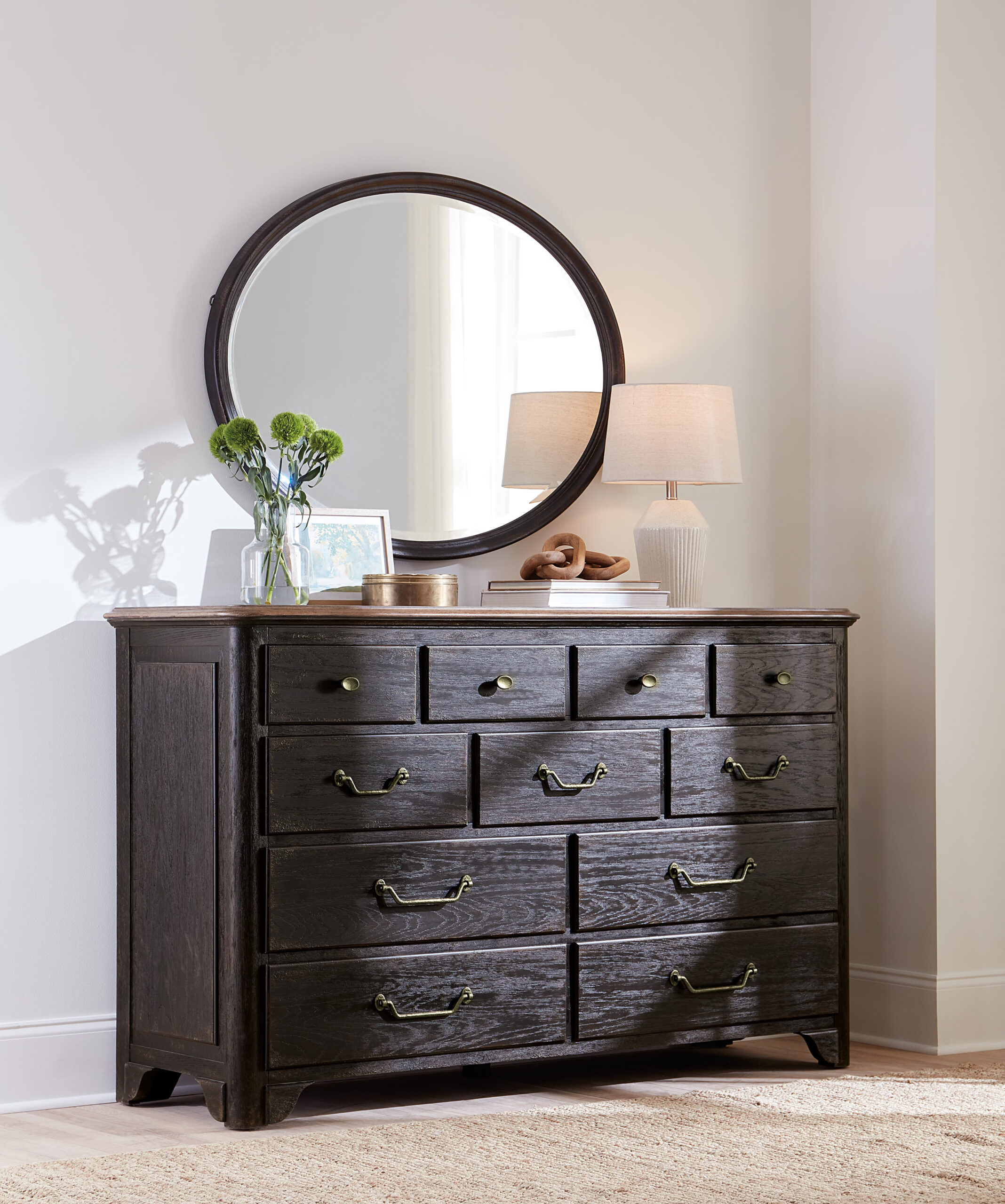 11-drawer dresser with self-closing drawers, two-tone finish in blacks and honey, oak veneers, cedar-lined bottom drawers, and antique bronze metal pulls.