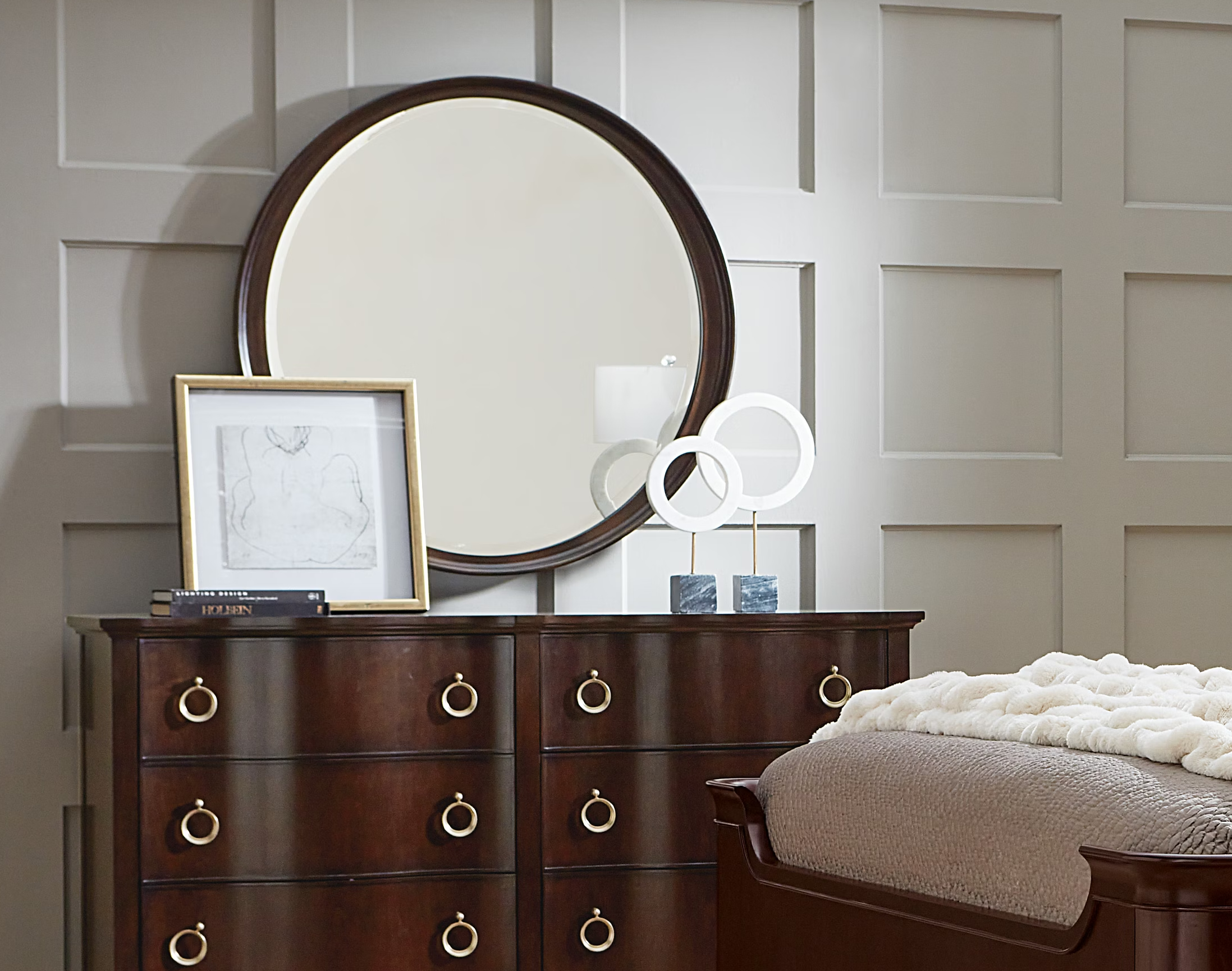 Hooker Furniture Bella Donna round mirror featuring a beveled edge, crafted with a dark wood Caviar finish over rich cathedral cherry veneers. Transitional style with elegant design inspired by Sophia Loren, part of the Bella Donna bedroom collection.