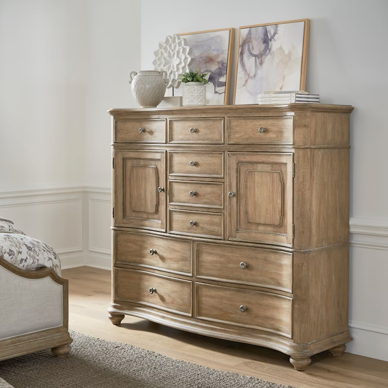 Weston Hills Master Chest with 6 small drawers, 2 doors with adjustable shelves, and 4 spacious drawers, featuring split heart cathedral hickory veneer, aged pewter hardware, bun feet, and a flax seed finish with walnut inlay.