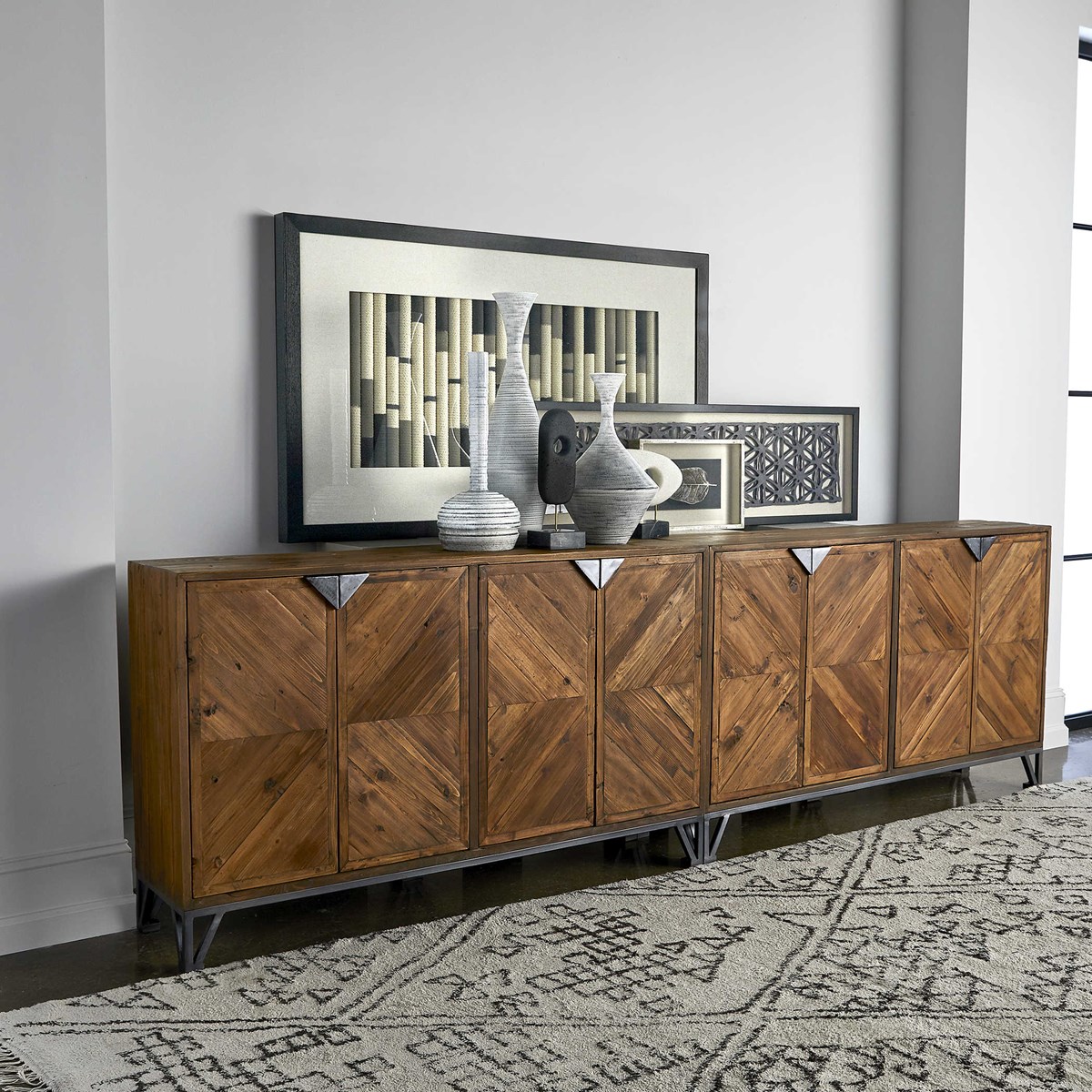 Reclaimed solid fir sideboard with a geometric front, aged iron pocket door pulls, and adjustable shelves. Natural wood grain and distressing for a rustic look.