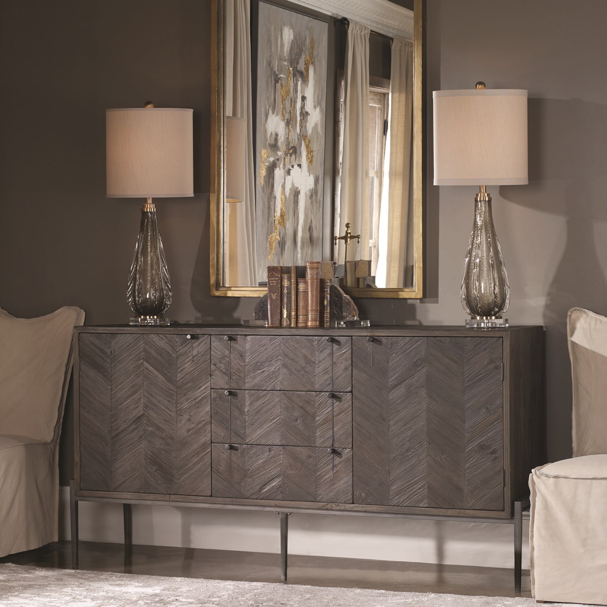 Hand-pieced from recycled pine, the Mavis Sideboard features a chevron pattern in dark walnut, set in an aged iron frame with black iron hardware.