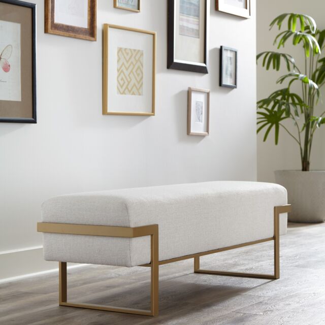 Athena bench seating in Opaque Gold finish with Sugarshack Pearl performance fabric. Elegant and durable, perfect for adding a touch of luxury to any room.