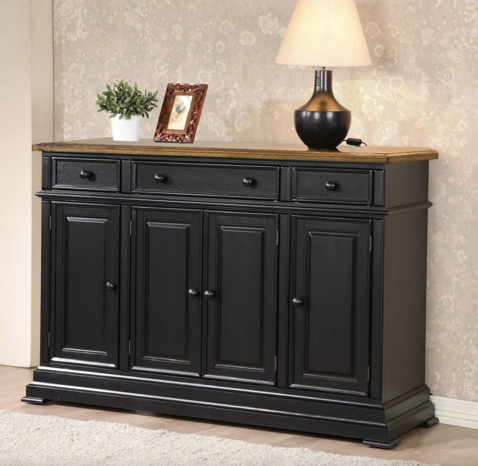 60" sideboard crafted from solid hardwood with thick tops and turned legs. Features three drawers, two cabinets, and adjustable shelves.