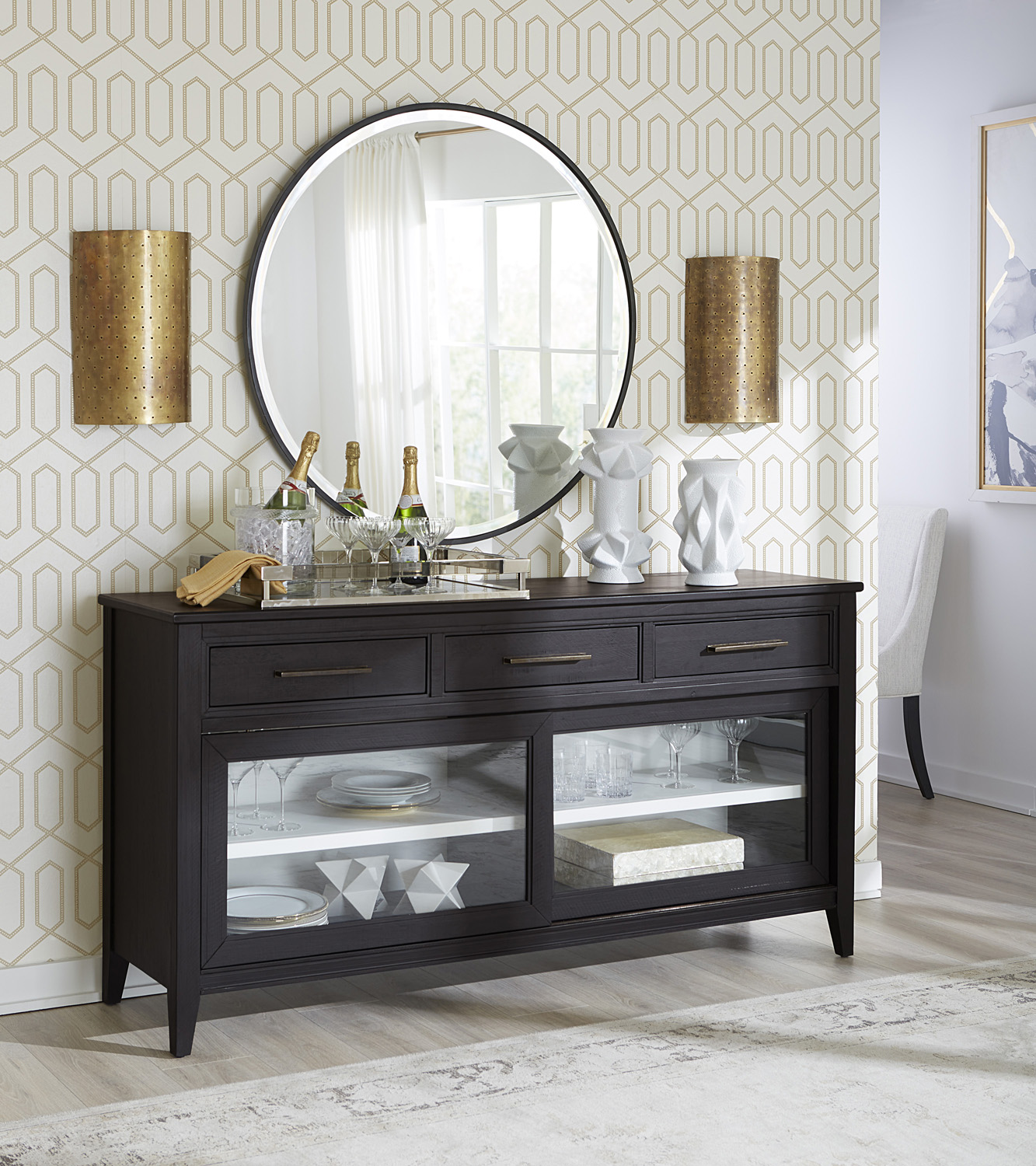 Camden Collection sideboard by aspenhome in a transitional style with a black Domino finish. Made from pine wood and veneer, featuring aged bronze pull hardware for a fresh take on a classic silhouette. Dimensions not specified.