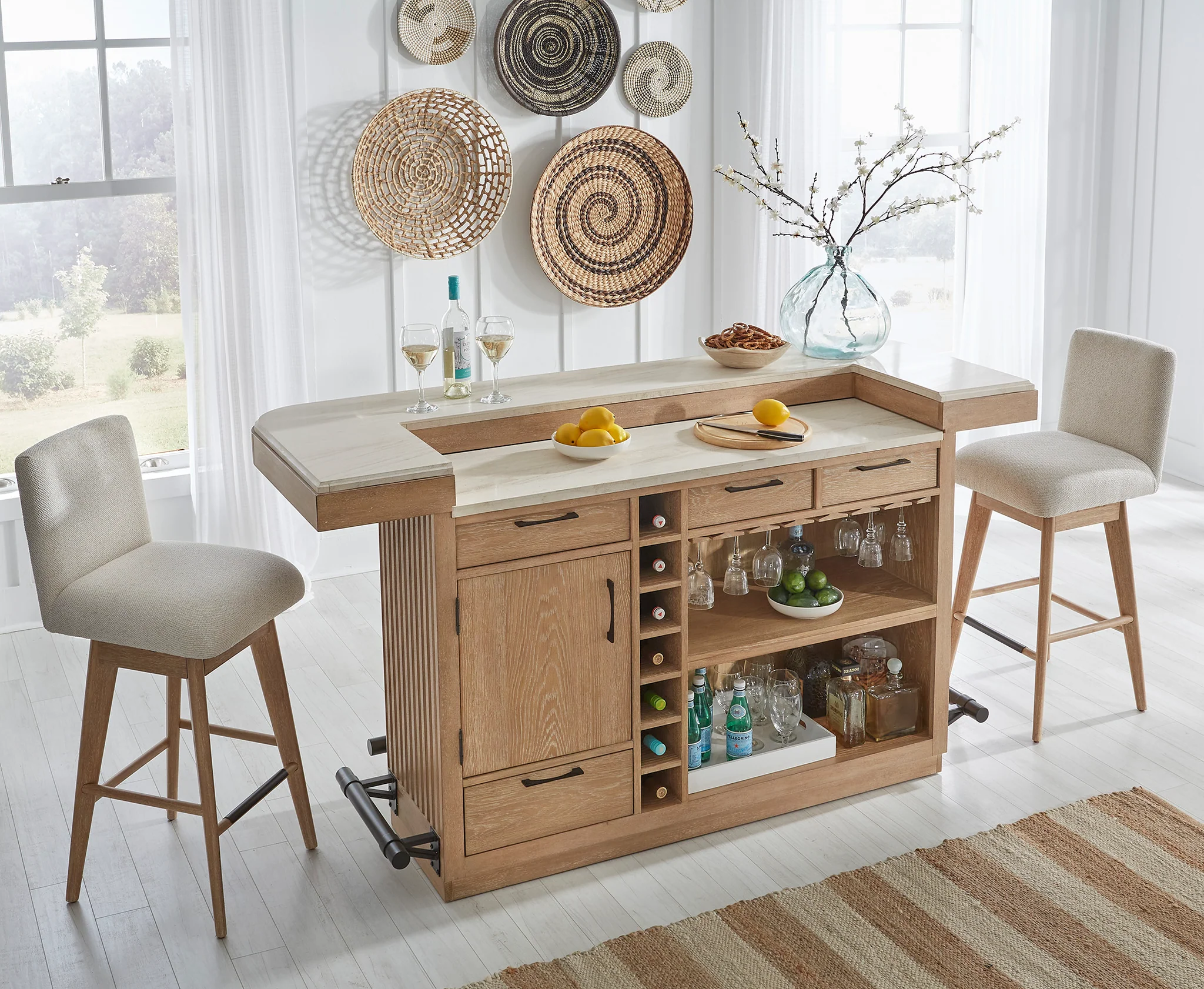 Stylish Parker House home bar with matching barstools, featuring a sleek design and ample storage for bottles and glassware in a modern home setting.