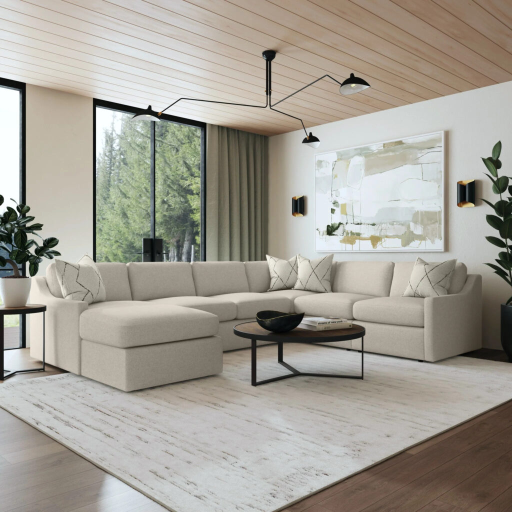 Elegant Flexsteel sectional sofa in a modern living room with large windows, neutral tones, and natural light.