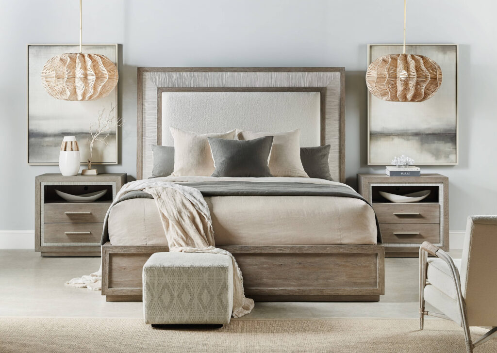 Beautiful neutral-toned bedroom with wood-accented bed, nightstands, and soft lighting, featuring cozy linens and modern décor.