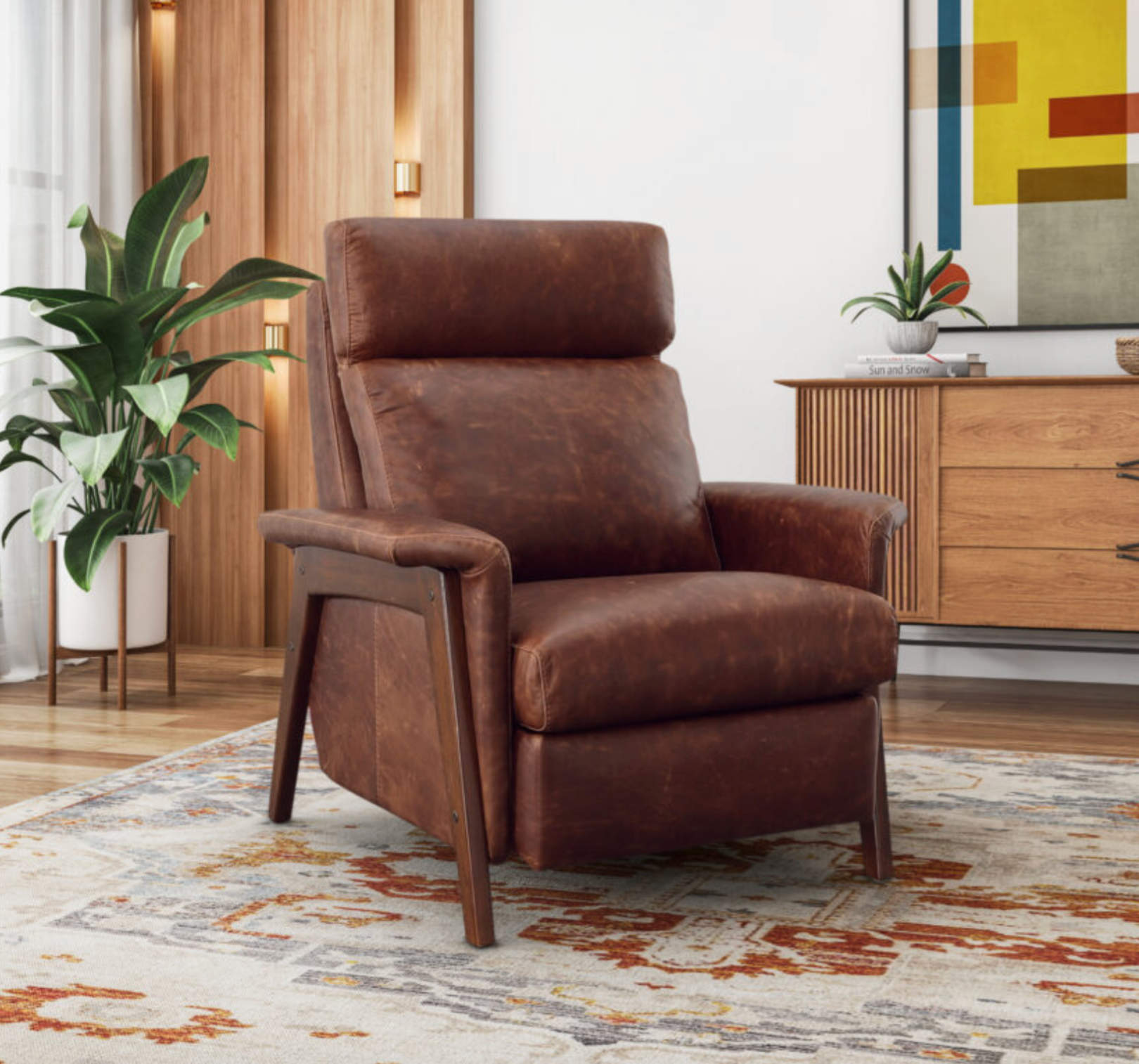 Elegant Omnia Leather chair and ottoman set in a stylish living space, featuring premium handcrafted leather upholstery and timeless design.