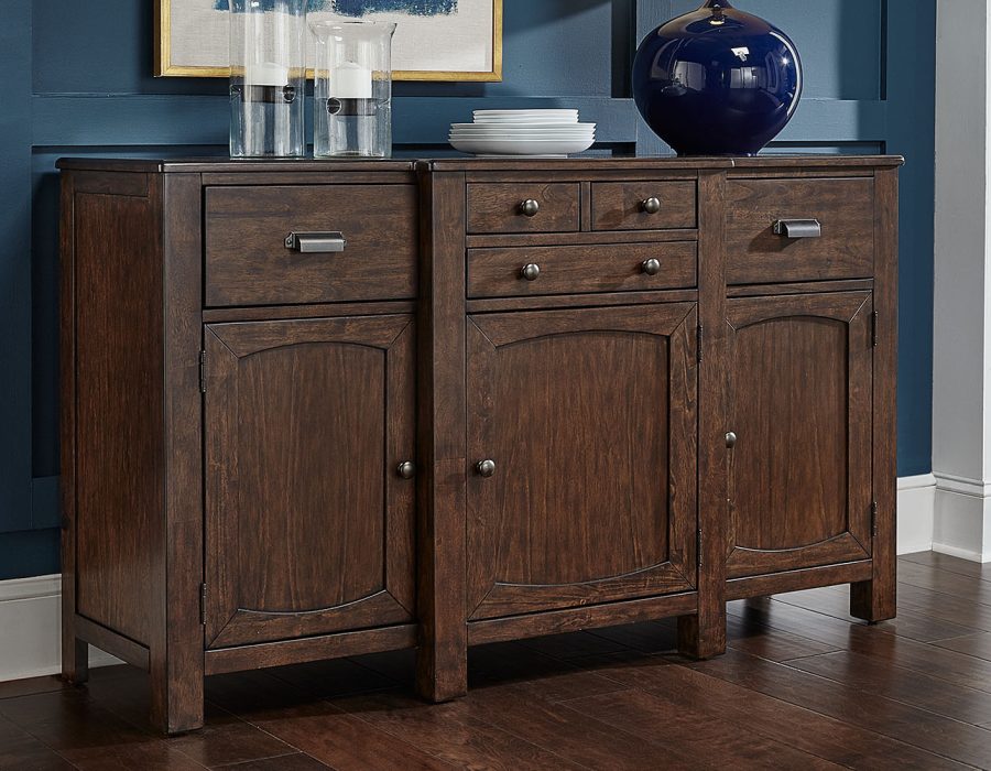 A-America Henderson sideboard crafted from solid hardwood in a Muscavado Brown finish. Featuring a dark wood tone and antiqued bronze hardware. Dimensions: 36.25H x 62W x 20D.