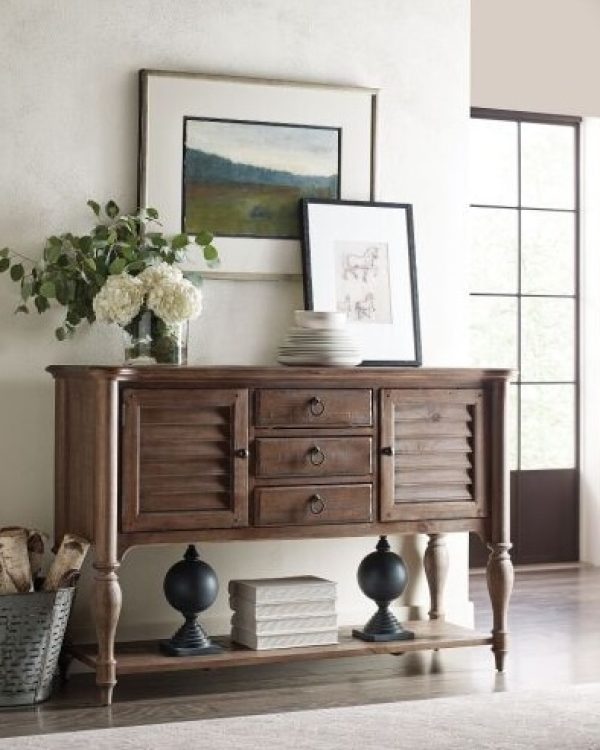 Kincaid Edisto Sideboard made from New Zealand pine, featuring two doors, three drawers, two adjustable shelves, a silverware tray in the top center drawer, and a bottom shelf. Durable solid wood construction designed to last for generations.